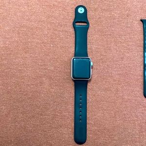 Apple Watch 38mm series 3 with 2 additional bands and a charger